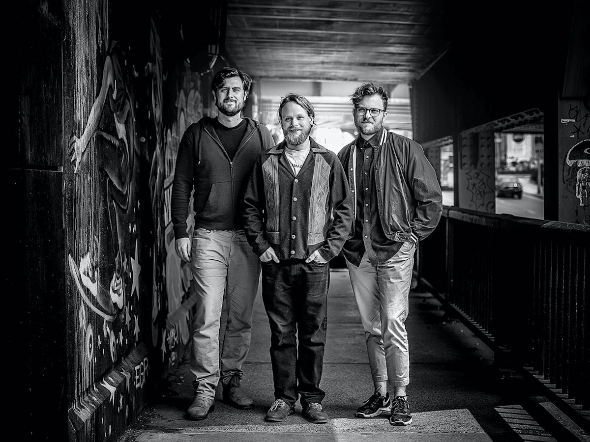 Black and white image of EiQ Technologies founders Adam Kingsmith, Will Jaques and Julian von Bargen