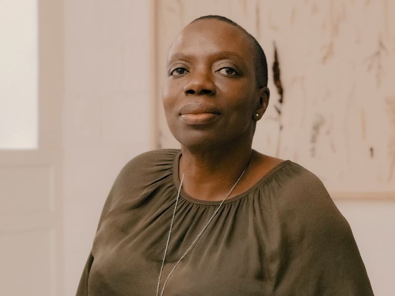 Annette Bailey in a brown satin blouse 