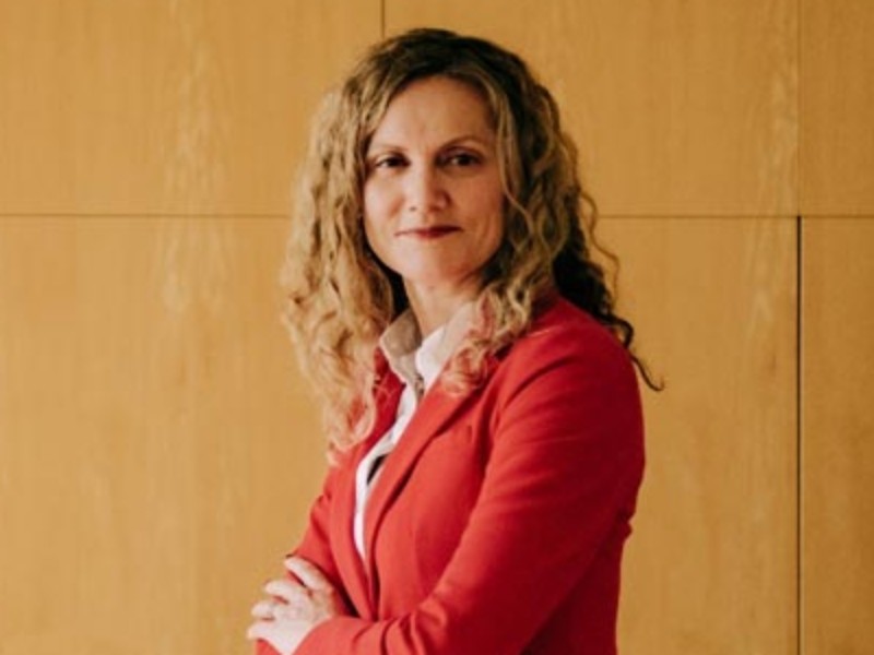 Jenny O'Donnell, Chief Human Resources Officer in a red blazer 