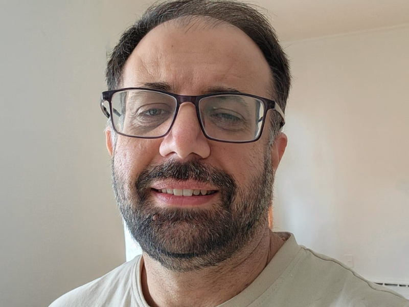 Dr. Muhammad Sad Khan smiling.