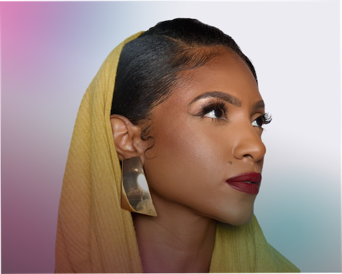  "A close-up, profile-angle portrait of Naomi Cowan. She has dark hair styled sleekly with detailed edges, wearing a mustard-yellow headwrap and large, geometric gold statement earrings. She has a bold red lip and is looking upward and to the right. The background is a soft, out-of-focus gradient of white, pink, and teal."