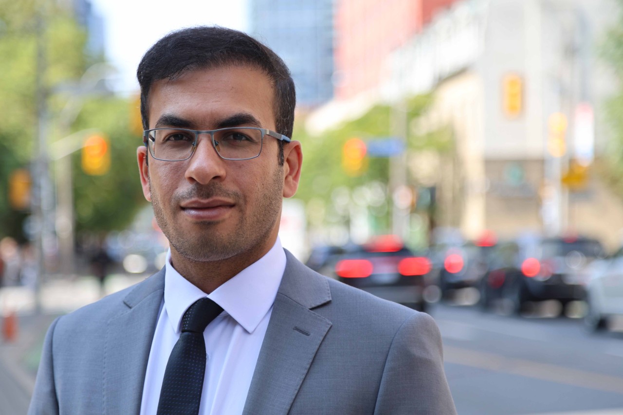 Hossein with the city background