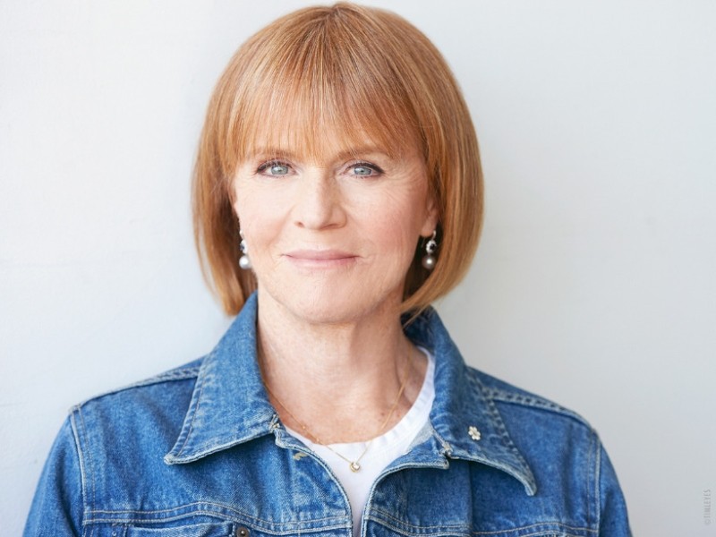 Valerie Pringle in a denim shirt against a white background.