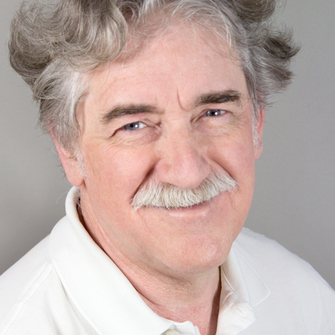 Headshot of Adam Kolodziej smiling