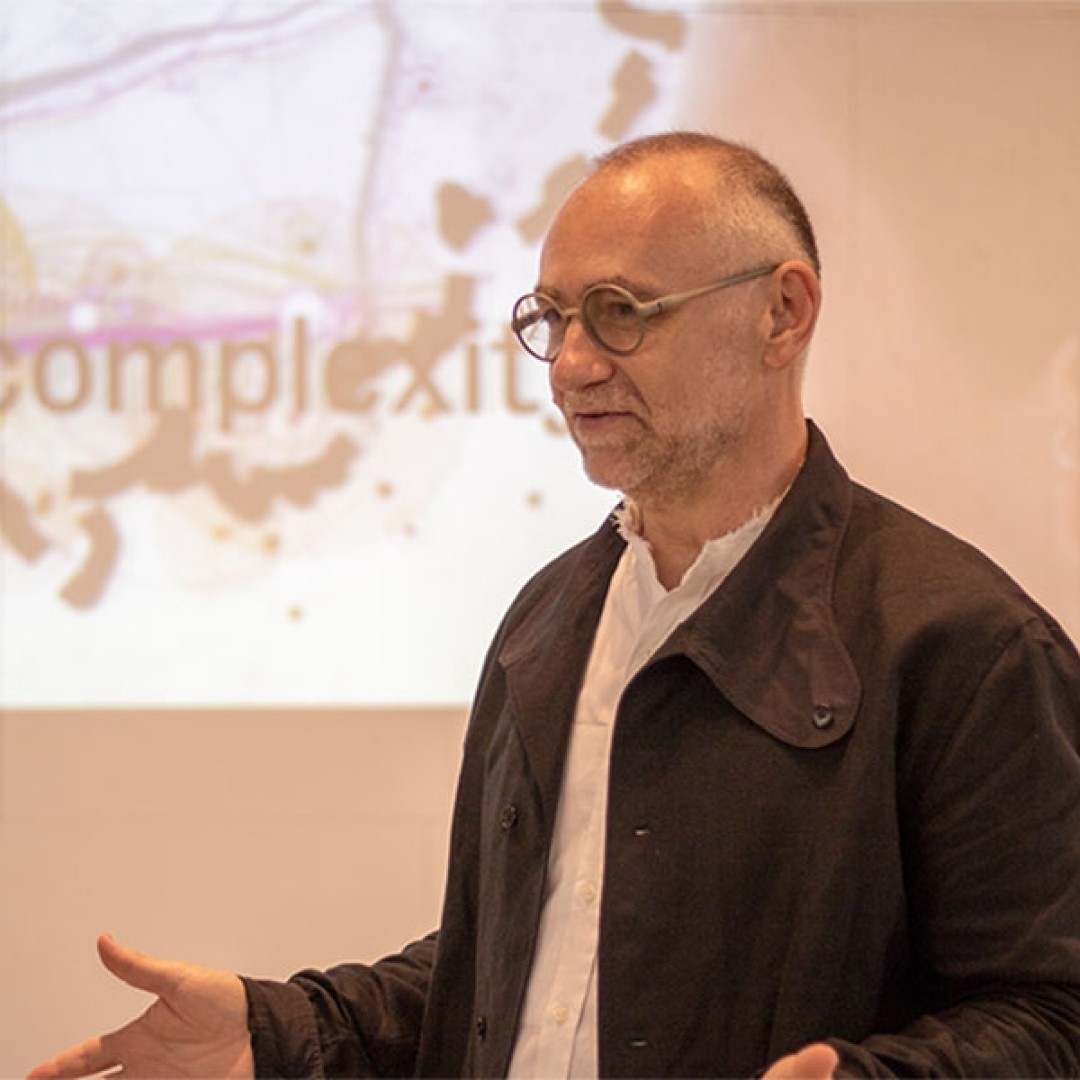 Headshot of Colin Ripley talking to an audience