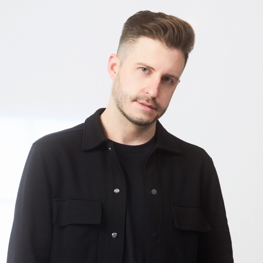 Headshot of Evan Pavka wearing black shirt 