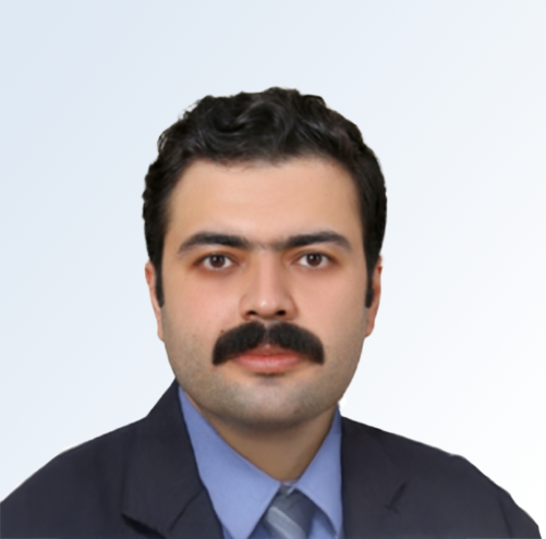 Headshof of Dr. Arash Mahari in a blue shirt and black blazer