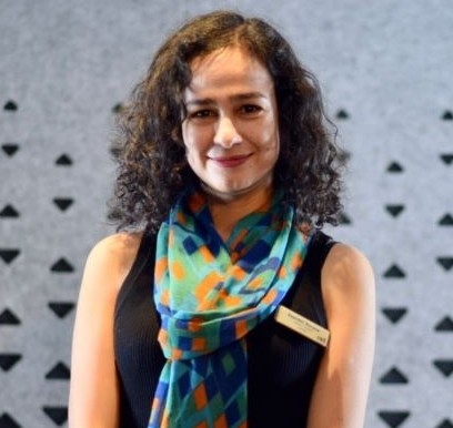 Dr. Sapideh Borzoo wearing a black dress and blue scarf.